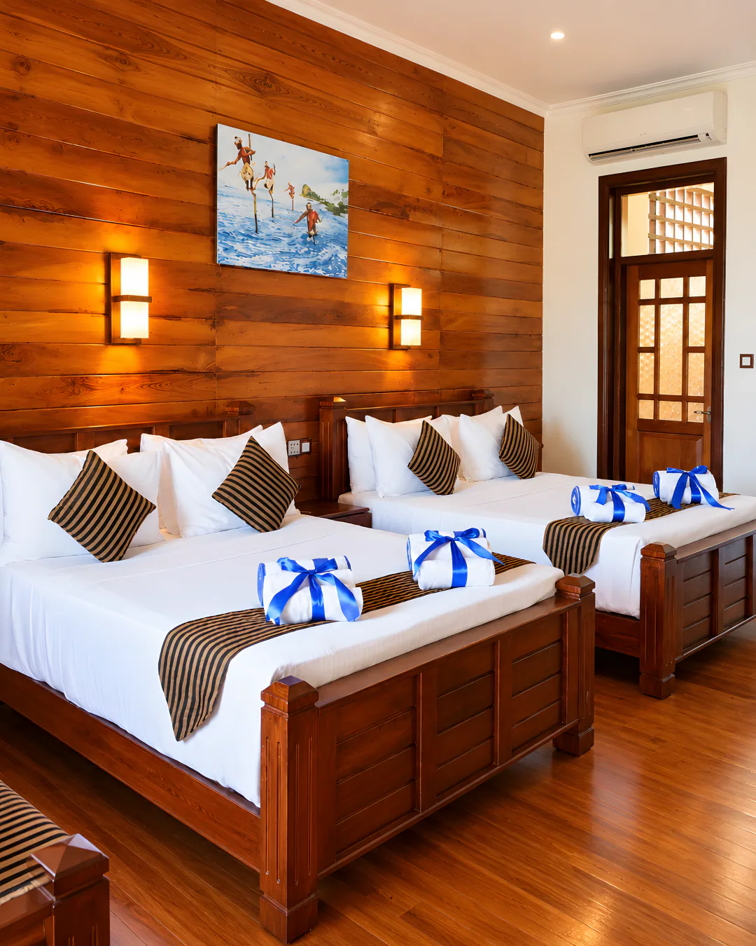 Family room with two double beds and timber panelling