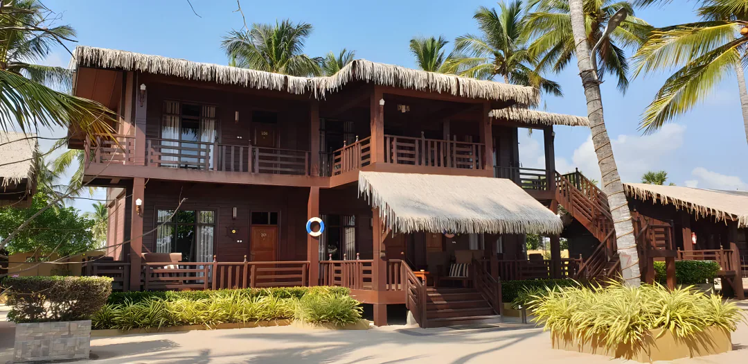 The two-storey timber resort building with balconies, verandas and a life ring